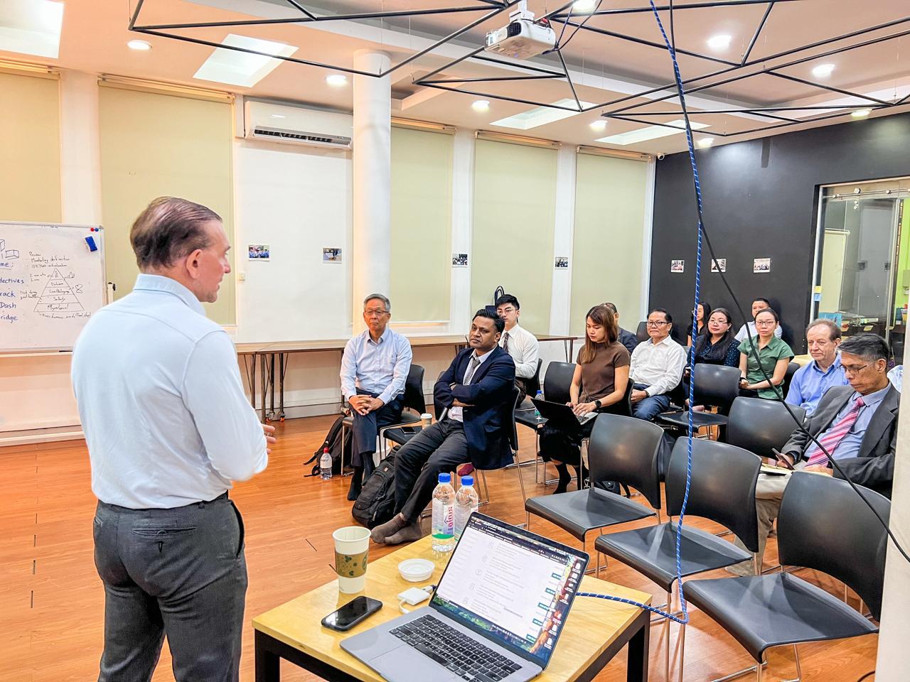 Professor Andrew Delios at the head of the class at the National University of Management (NUM)
